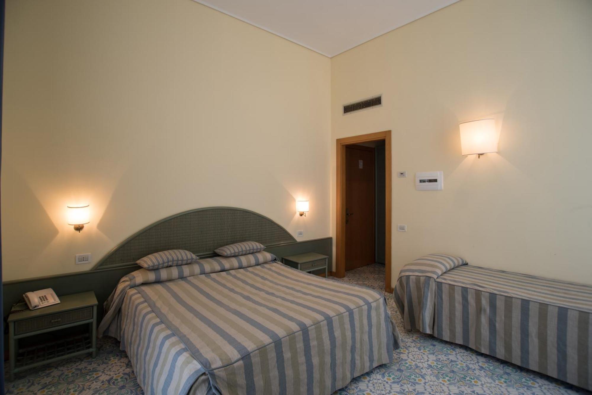 Quadruple Room (2 Adults + 2 Children)